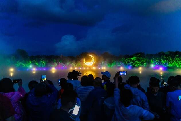 July 19, 2019 - Jilin, Jilin, China - Jilin, CHINA-The musical fountain lighting show in Jingyuetan national forest park in Changchun, capital of northeast China s Jilin province, opens on July 1, 2019.Music fountain waterscape light show is located in the goddess square at the main entrance of jingyuetan, taking the statue of the goddess of the clear moon as the central point, composed of fountain, LED beam light, LED full color tree light, LED full color wash wall light, pattern light, etc., which can combine hundreds of action forms. Jilin China - ZUMAs145 20190719_zaa_s145_059 Copyright: xChixXiaoweix