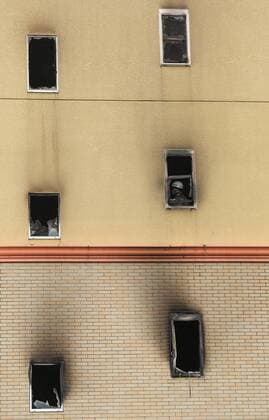 (190719) -- KYOTO, July 19, 2019 -- A fireman works inside a Kyoto Animation studio building after an arson attack in Kyoto, Japan, July 19, 2019. The motive behind an alleged arson attack on a studio of Kyoto Animation Co. in western Japan, which killed 33 people a day earlier, may have been the theft of ideas, sources said Friday. Local media quoting investigative sources, said that a 41-year-old man apprehended over the alleged arson attack told police he started the fire at the three-story studio because the company stole a novel. ) JAPAN-KYOTO-ANIME STUDIO FIRE DuxXiaoyi 