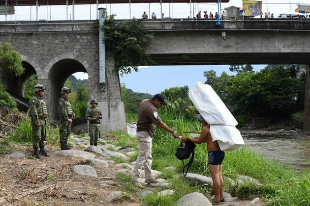 July 24, 2019, Talisman, Chiapas, Mexico: Mexican marines and immigration officers check IDs of Guatemalan porters crossing goods illegally into Mexican territory on Wednesday. Hundreds of such crossings happen every day as the flow of migrants has moved to isolated spots along the Suchiate River, which marks the border between the two nations. Mexican President Lopez ObradorÃ¢â‚¬â ¢s administration claims to have reduced the flow of migrants looking to reach America, but much of the flow continues in remote border areas. Talisman Mexico - ZUMAl113 20190724_zap_l113_009 Copyright: xMiguelxJuarezxLugox