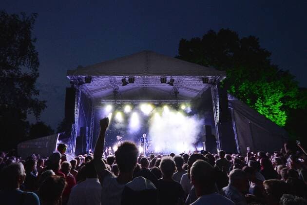 Music Festival Heimspiel Knyphausen 26 28 July 2019 , Concert on 26 July 2019 Concert of the band Tocotronicam 26 July at the Music Festival Heimspiel Knyphausen 2019 In the background singer Dirk von Lotzow middle of the band Tocotronic on guitar Eltville am Rhein Hessen Germany Draiser Hof