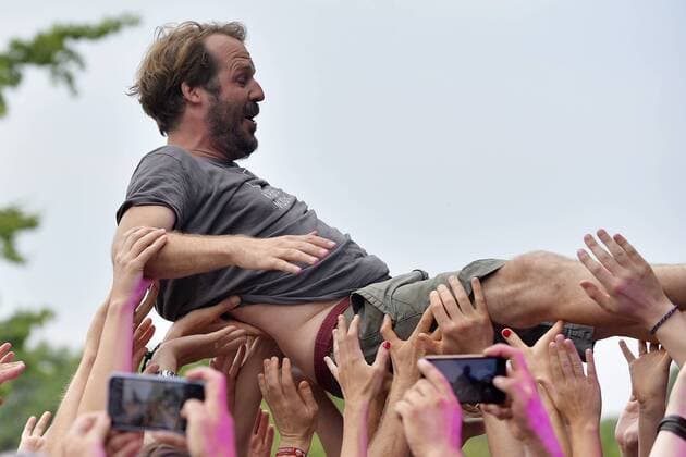 Music festival Heimspiel Knyphausen 26 28 July 2019 , concert of the band Gurr on 26 July 2019 Gisbert zu Knyphausen, host of the festival, at the stage diving during the performance of the band Gurr at the music festival Heimspiel Knyphausen 2019 Eltville am Rhein Hessen Germany Draiser Hof