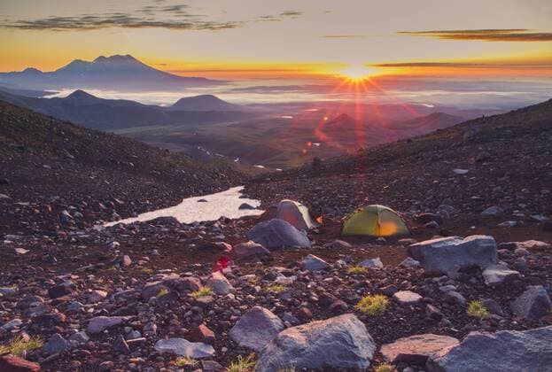 Tents in volcanic landscape, Kamchatka, Russia  IHF00138