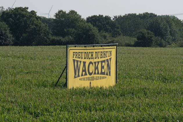 You are in Wacken See you are in Wacken Rain or Shine sign at the motorway exit A23 Wacken Open Air WOA 2019, Wacken Schleswig Holstein Germany Festival area