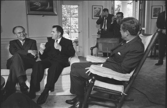 Anatoly F. Dobrynin and Andrei Gromyko Soviet ambassador to the US, Anatoly F. Dobrynin and Soviet foreign minister Andrei Gromyko talking with President Kennedy who is seated in rocking chair, at the White House, Washington, D.C. during the Cuban missile crisis. October 18, 1962 Copyright: xPhoto12 AnnxRonanxPicturexLibraryx ARP18A09229