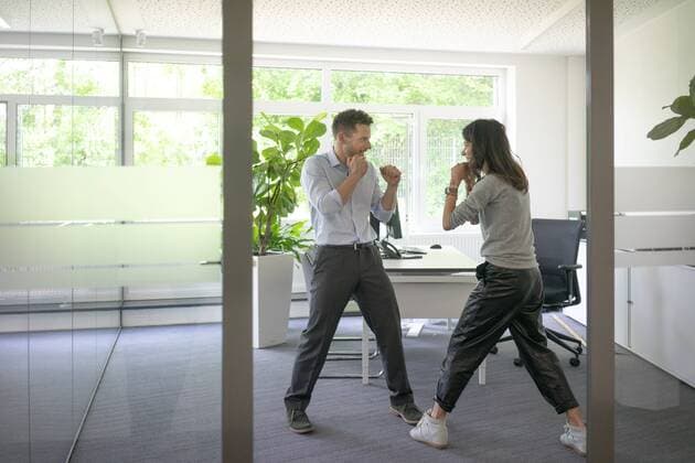 Businessman and businesswoman fighting in office model released Symbolfoto property released  MOEF02222