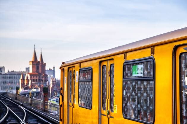 Train on elevated railway in front of Oberbaum Bridge at twilight, Berlin, Germany  PUF01623