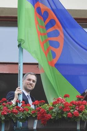 The Roma flag flies at the Prague City Hall to commemorate the Roma Holocaust Memorial Day today, on Friday, August 2nd, 2019. Prague Mayor Zdenek Hrib (Pirates), along with several councillors and representatives of the Prague Assembly member groups hoisted the blue-green flag with a red circle this morning. The European Roma Holocaust Memorial Day reminds of the night of August 2-3, 1944 when the Nazis liquidated the Gypsy family camp in Auschwitz-Birkenau, killing almost 3,000 men, women and children. (CTKxPhoto MichaelaxRihova) CTKPhotoP201908020568301  mir 12