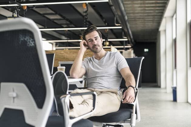 Young businessman working relaxed in modern office, thinking model released Symbolfoto property released  UUF17813
