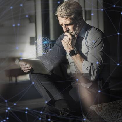 Mature businessman using tablet surrounded by virtual globe and lines model released Symbolfoto property released  UUF17921