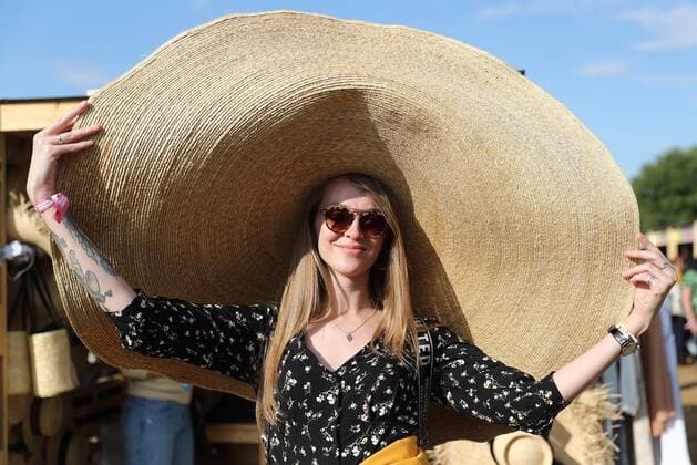 MOSCOW, RUSSIA - AUGUST 3, 2019: A young girl attends the 2019 Afisha Picnic music festival at Moscow s Kolomenskoye Museum-Reserve. Anton Novoderezhkin TASS  TS0B5556