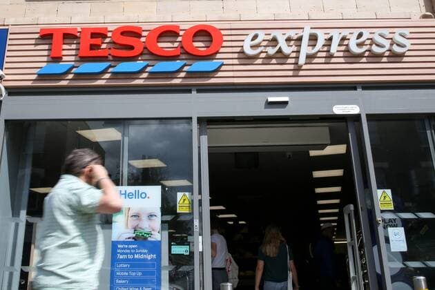 August 5, 2019, London, UK, UK: London, UK. A man walks past Tesco Express on Green Lanes, Haringey, north London. .According to Tesco, it is to cut 4,500 jobs from its 153 Metro stores and 134 Express stores in latest round of redundancies. London UK  - ZUMAl94_ 20190805_zaf_l94_047 Copyright: xDinendraxHariax