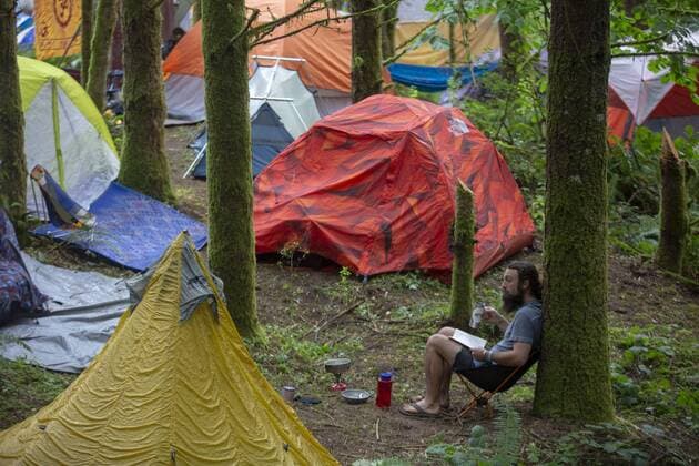 August 2, 2019, Happy Valley, Oregon, U.S: A man reads a book in the camping section at the Pickathon Music festival in Happy Valley Oregon August 2, 2019. Happy Valley U.S. - ZUMAb190 20190802_znp_b190_002 Copyright: xNataliexBehringx