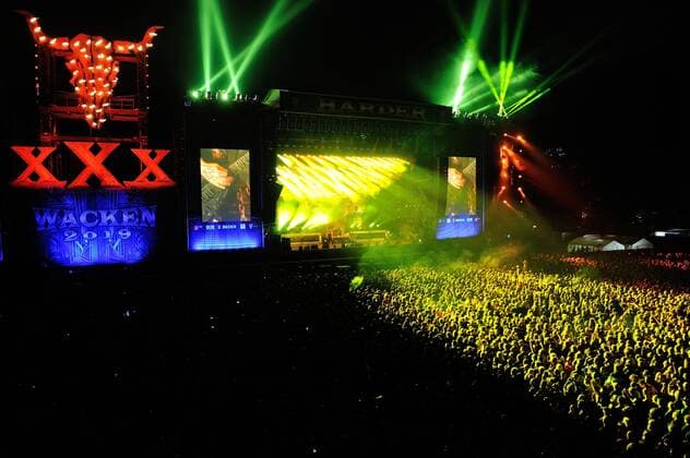 Festival visitors in front of the main stage during SLAYERs performance at the 30 Wacken Open Air Festival W O A 2019 snapshot photography R Jaenecke