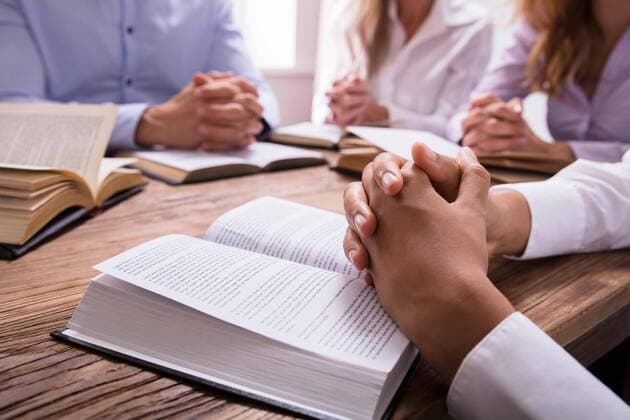  Woman s Praying Hand On Bible ,model released, Symbolfoto  Copyright: xAndreyPopovx Panthermedia25817970