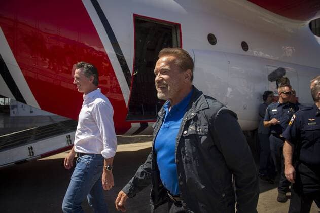 August 1, 2019, California, USA: California Gov. Gavin Newsom, right, and Former Gov. Arnold Schwarzenegger walk past a C-130 plane after a press conference at McClellan Air Force Base in Sacramento, Calif. Thursday, August 1, 2019. USA - ZUMAs76_ 20190801_zaf_s76_002 Copyright: xDanielxKimx