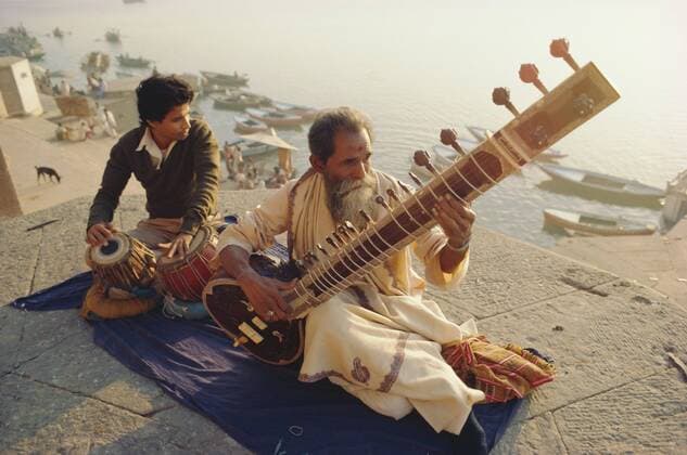 Musicians playing the Sitar and Tabla on the banks of the River Ganges (Ganga), Varanasi (Benares), Uttar Pradesh State, India Copyright: JohnxHenryxClaudexWilson 17-1217
