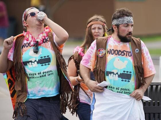 Attendees arrive at the 50th anniversary of the Woodstock Music Festival at Bethel Woods Center For The Arts on Friday, August 16, 2019 in Bethel, New York. Woodstock was a music festival held August 15Ð18, 1969, which attracted an audience of more than 400,000 and is widely regarded as a pivotal moment in popular music history.  NYP20190816128 JOHNxANGELILLO