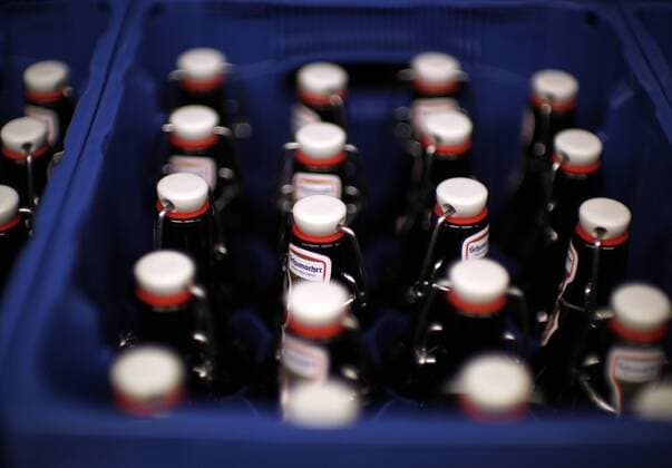 Düsseldorf, Germany, 15 08 2019 Beer bottles with swing top closures in a beer crate of the Düsseldorf private brewery Schumacher stand in the METRO wholesale store in Düsseldorf