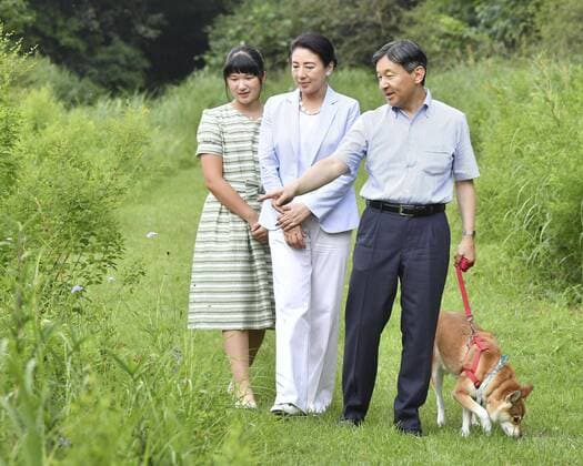 Japan imperial family on summer vacation (From R) Japanese Emperor Naruhito, Empress Masako and their daughter Princess Aiko take a stroll with their dog Yuri at Nasu Imperial Villa in Tochigi Prefecture, eastern Japan, on Aug. 19, 2019. (Pool photo) 