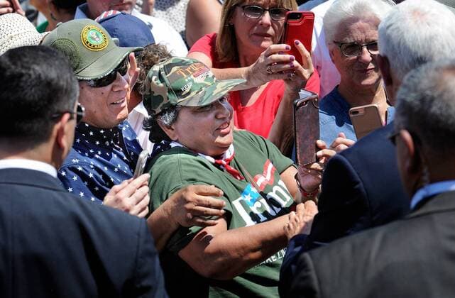 August 21, 2019, Artesia, NM, USA: Lilia G. Santana and her husband Fernando Santana of Loving NM takes a picture and then meet Vice President Mike Pence at Elite Well Services in Artesia, NM. Wednesday, Aug. 21, 2019. Artesia USA - ZUMAab1_ 20190821_zaf_ab1_015 Copyright: xJimxThompsonx
