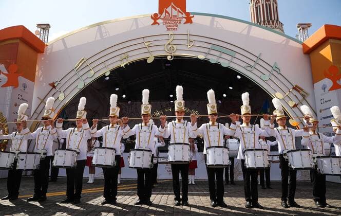 MOSCOW, RUSSIA - AUGUST 23, 2019: Participants in the Spasskaya Tower Festival of Children s Wind Bands perform at the Children Playground in Red Square as part of the 12th Spasskaya Tower International Military Music Festival. Mikhail Tereshchenko TASS  TS0B77DC