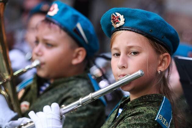 MOSCOW, RUSSIA - AUGUST 23, 2019: Participants in the Spasskaya Tower Festival of Children s Wind Bands perform at the Children Playground in Red Square as part of the 12th Spasskaya Tower International Military Music Festival. Mikhail Tereshchenko TASS  TS0B77DE