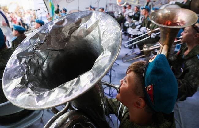 MOSCOW, RUSSIA - AUGUST 23, 2019: Participants in the Spasskaya Tower Festival of Children s Wind Bands perform at the Children Playground in Red Square as part of the 12th Spasskaya Tower International Military Music Festival. Mikhail Tereshchenko TASS  TS0B77E1