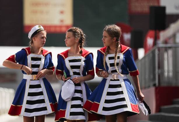 MOSCOW, RUSSIA - AUGUST 23, 2019: Girls take part in the Spasskaya Tower Festival of Children s Wind Bands at the Children Playground in Red Square as part of the 12th Spasskaya Tower International Military Music Festival. Mikhail Tereshchenko TASS  TS0B77E2