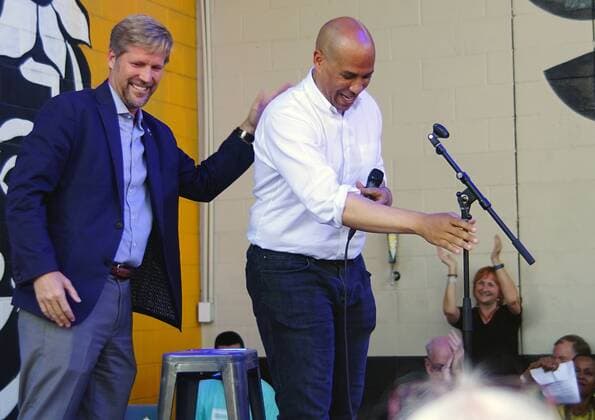 August 26, 2019, Albuquerque, NEW MEXICO, USA: 082619 .Mayor Tim Keller,<cq>, left gives a pat on the back of U.S Senator and Democratic Party Presidential Candidate Corey Booker,<cq>, as he gets ready to addresssupporters at a fundraiser held at Marble Brewery in Downtown Albuquerque .Photographed on Monday August 26, 2019. Journal Albuquerque USA - ZUMAab1_ 20190826_zaf_ab1_006 Copyright: xAdolphexPierre-Louisx