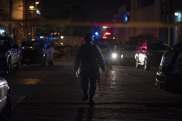 (190828) -- COATZACOALCOS, Aug. 28, 2019 (Xinhua) -- A security member patrols near a nightclub in Coatzacoalcos, Mexico, Aug. 27, 2019. A total of 23 people were killed and some 10 others seriously injured when a nightclub in eastern Mexico was set on fire Tuesday night, local authorities said. (Photo by Angel Hernandez Xinhua) (SPOT NEWS)MEXICO-COATZACOALCOS-NIGHTCLUB-FIRE 