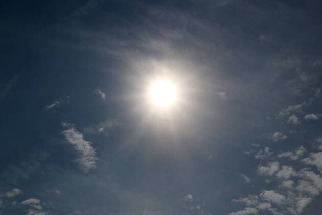 Heat wave and drought Gleißende sun between single small clouds in the sky before the formation of partly violent thunderstorms Essen Nordrhein Westfalen Germany