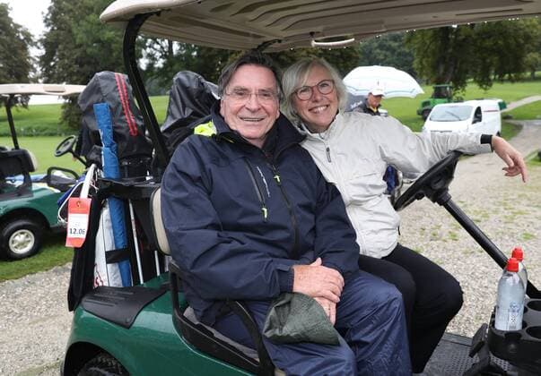 25 Tabaluga Golf Tournament in favour of the Mcihael Roll Tabaluga Foundation Elmar Wupper with wife Anita Schliert in the golf cart, Tutzing Deutschland Golfclub Tutzing