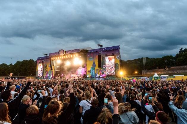 Visitors in front of the main stage at the music festival Lollapalooza in Berlins Olympic Stadium snapshot photography F Boillot