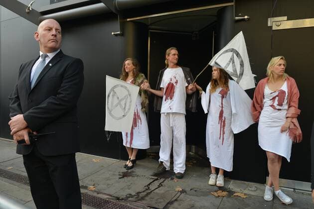 . 13 09 2019. London, United Kingdom. Supporters from Extinction Rebellion hold a protest against the fabric industry and its effects on the environment on the opening day of London Fashion Week.  xHowardxJonesx xi-Imagesx IIM-20146-0001