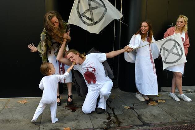 . 13 09 2019. London, United Kingdom. Supporters from Extinction Rebellion hold a protest against the fabric industry and its effects on the environment on the opening day of London Fashion Week.  xHowardxJonesx xi-Imagesx IIM-20146-0008