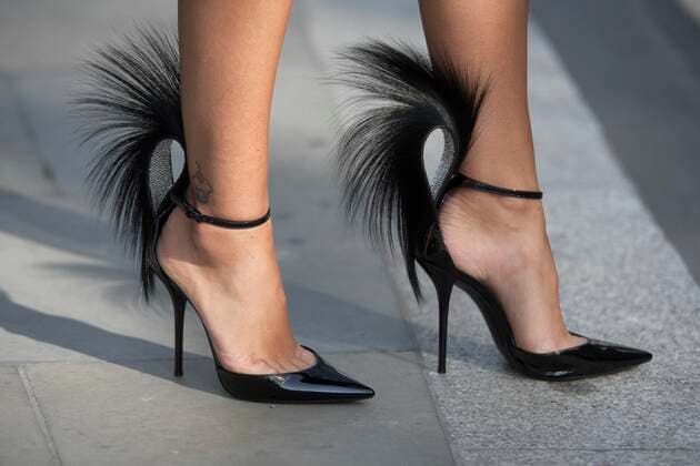 Street Style on day four of London Fashion Week SS 2020 on Sunday September 15th 2019, showcasing stylish individuals London is internationally known for. Image shows a pair of black patent high heel shoes with feather detail  (112328613)
