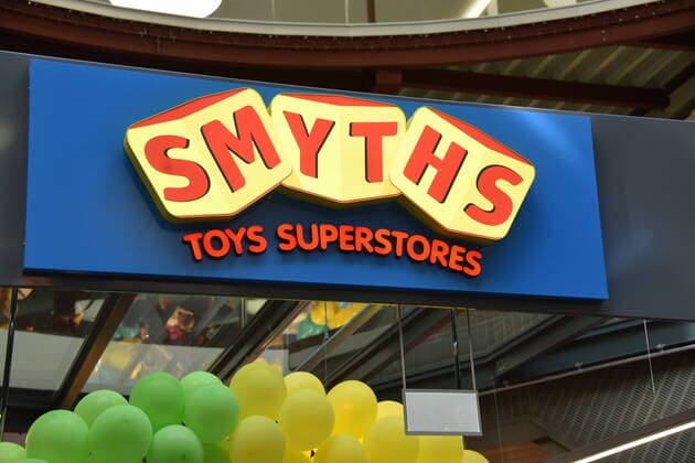 Logo, lettering at the entrance of a branch of Smyths Toys Superstores, Europes largest retailer of toys and baby products