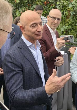 Amazon CEO Bezos Amazon.com Inc. CEO Jeff Bezos answers reporters questions in Seattle on Sept. 25, 2019. The U.S. tech giant unveiled a dozen wearable gadgets the same day. 