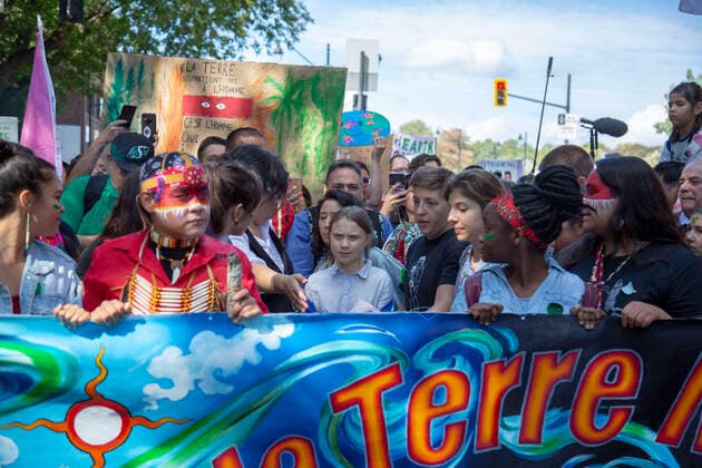 September 27, 2019 - Montreal, Quebec, Canada - Swedish climate activist GRETA THUNBERG joins the climate strike protest in Montreal marching along with young activists and their supporters. Hundreds of thousands of people marched along the streets of Downtown Montreal Friday afternoon demanding real action on climate change. Montreal Canada - ZUMAm182 20190927_int_m182_006 Copyright: xCristianxMijeax