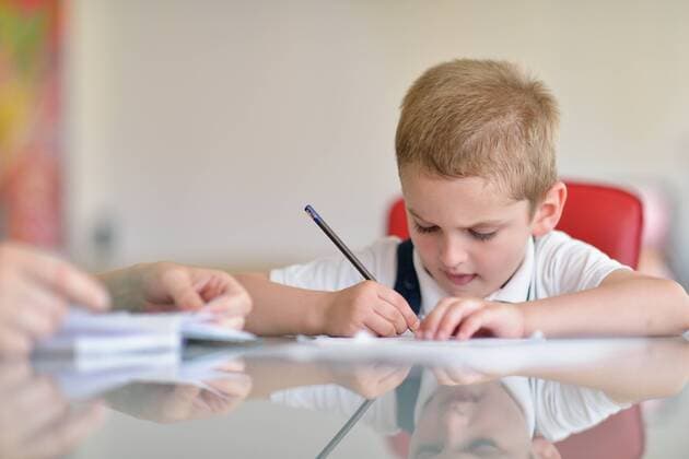 young mom woman doing home work with elementary school grade boy at home in kitchen,model released, Symbolfoto ING_32193_84051