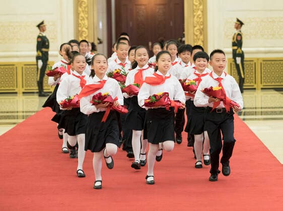 (190929) -- BEIJING, Sept. 29, 2019 -- Children, who are members of Chinese Young Pioneers, present flowers to the awardees of national medals and honorary titles during the presentation ceremony in the Great Hall of the People in Beijing, capital of China, Sept. 29, 2019. China held the presentation ceremony of the national medals and honorary titles on Sunday at the Great Hall of the People, ahead of the 70th anniversary of the founding of the People s Republic of China (PRC) on Oct. 1. ) CHINA-BEIJING-NATIONAL MEDALS-HONORARY TITLES-PRC FOUNDING-70TH ANNIVERSARY (CN) WangxYe 