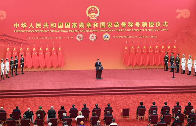 (190929) -- BEIJING, Sept. 29, 2019 -- Chinese President Xi Jinping, also general secretary of the Communist Party of China Central Committee and chairman of the Central Military Commission, delivers a speech at the presentation ceremony of the national medals and honorary titles of the People s Republic of China at the Great Hall of the People in Beijing, capital of China, Sept. 29, 2019. Xi presented the medals to the awardees before the speech. ) CHINA-BEIJING-NATIONAL MEDALS AND HONORARY TITLES-PRESENTATION CEREMONY (CN) YinxBogu 