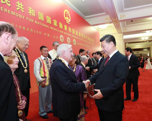 (190929) -- BEIJING, Sept. 29, 2019 -- Chinese President Xi Jinping, also general secretary of the Communist Party of China Central Committee and chairman of the Central Military Commission, communicates with Jean-Pierre Raffarin, the honoree of the Friendship Medal, at the Great Hall of the People in Beijing, capital of China, Sept. 29, 2019. Xi on Sunday presented national medals and honorary titles of the People s Republic of China at a ceremony in the Great Hall of the People and delivered a speech. ) CHINA-BEIJING-NATIONAL MEDALS AND HONORARY TITLES-PRESENTATION CEREMONY (CN) PangxXinglei 