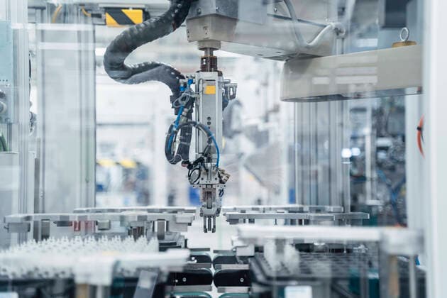 Arm of assembly robot functioning inside modern factory, Stuttgart, Germany  DIGF07183