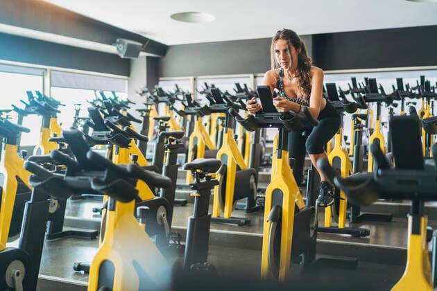 Woman in spinning class in gym model released Symbolfoto property released  DLTSF00087