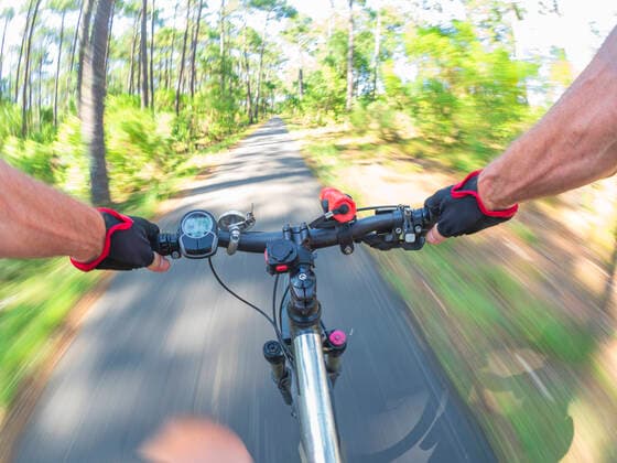 France, Landes, senior man on e-bike in the forest model released Symbolfoto  LAF02073