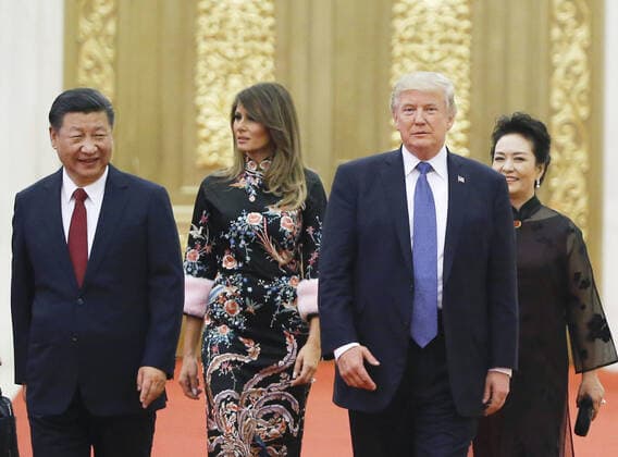 U.S., Chinese presidents, wives Photo taken Nov. 9, 2017, shows U.S. President Donald Trump (2nd from R), his wife Melania (3rd from R), Chinese President Xi Jinping and his wife Peng Liyuan upon their arrival at the Great Hall of the People in Beijing. 