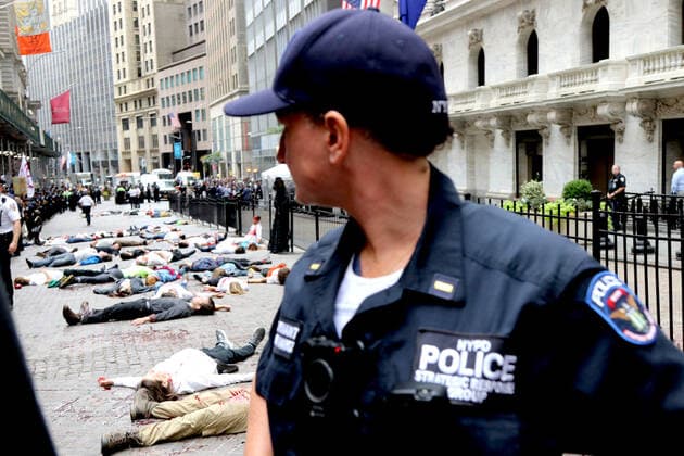 October 7, 2019, New York City, New York, US: Climate action group Extinction Rebellion launched a series of climate change protests around the globe on 7 October 2019, that featured large numbers of New York climate activists descending on lower Manhattan in actions that saw the iconic Charging Bull statute showered In Fake Blood and a die-in at the New York Stock Exchange on Wall Street, resulted in many arrests. New York City US - ZUMAl135 20191007_zap_l135_027 Copyright: xG.xRonaldxLopezx