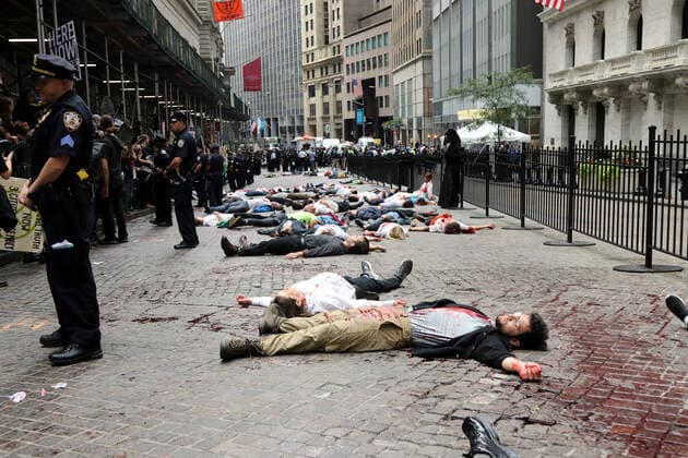 October 7, 2019, New York City, New York, US: Climate action group Extinction Rebellion launched a series of climate change protests around the globe on 7 October 2019, that featured large numbers of New York climate activists descending on lower Manhattan in actions that saw the iconic Charging Bull statute showered In Fake Blood and a die-in at the New York Stock Exchange on Wall Street, resulted in many arrests. New York City US - ZUMAl135 20191007_zap_l135_010 Copyright: xG.xRonaldxLopezx