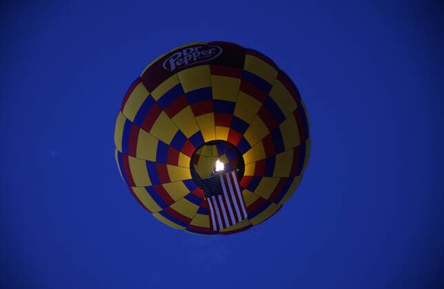 October 8, 2019, Albuquerque, NEW MEXICO, USA: 100819 .A hot air balloon carrying the American Flag takes off early Tuesday morning . Photographed on Tuesday October 8, 2019 . Journal Albuquerque USA - ZUMAab1_ 20191008_zaf_ab1_008 Copyright: xAdolphexPierre-Louisx